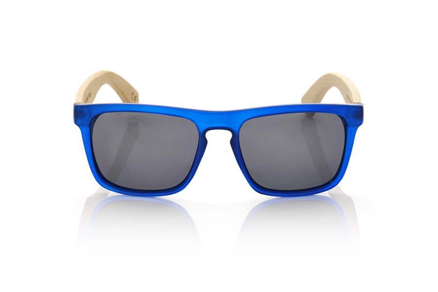 Wood eyewear of Bamboo WAVE BLUE. WAVE BLUE sunglasses are made with the front of transparent matte blue synthetic material and sideburns in bamboo, it's a very male angled square model with a look at the famous okley combined with four colors of lenses that will adapt perfectly to your taste and to your modern style. Front size: 145X50mm for Wholesale & Retail | Root Sunglasses® 