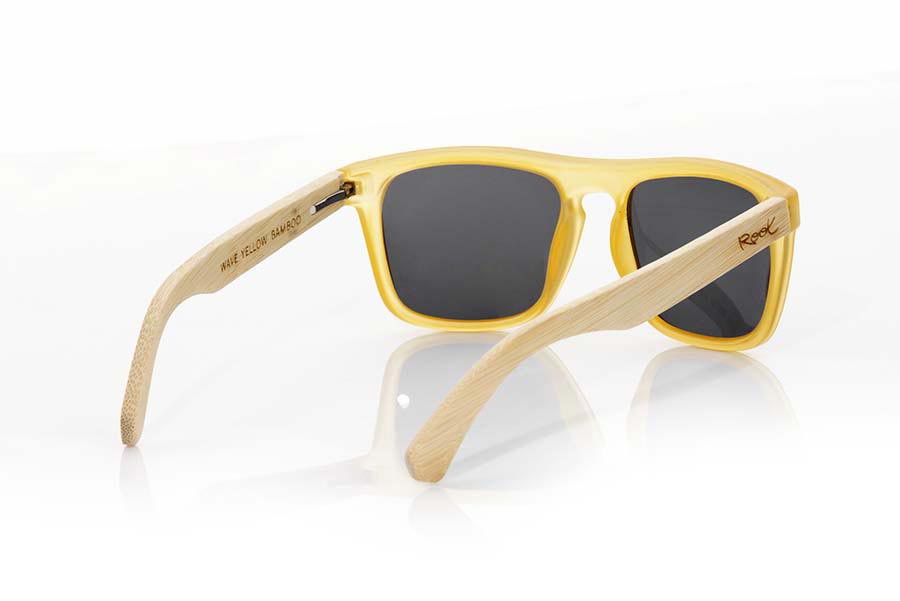 Wood eyewear of Bamboo WAVE YELLOW. WAVE YELLOW sunglasses are made of transparent matte yellow plastic front and sideburns in bamboo, it's a very male angled square model with a look at the famous okley combined with four colors of lenses that will adapt perfectly to your taste and to your modern style. Front size: 145X50mm for Wholesale & Retail | Root Sunglasses® 