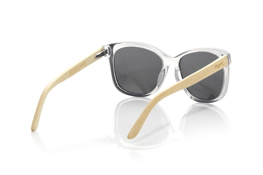 Wood eyewear of Bamboo BOLONIA. The BOLONIA sunglasses are made with the front in glossy and black color PC material and the Natural bamboo wood sideburns. In suggestive forms, the Bologna glasses are inspired by the BOLONIA(CADIZ) beach, the Bolonia sunglasses have been combined with several lenses. Frontal measurement: 143x53mm for Wholesale & Retail | Root Sunglasses® 