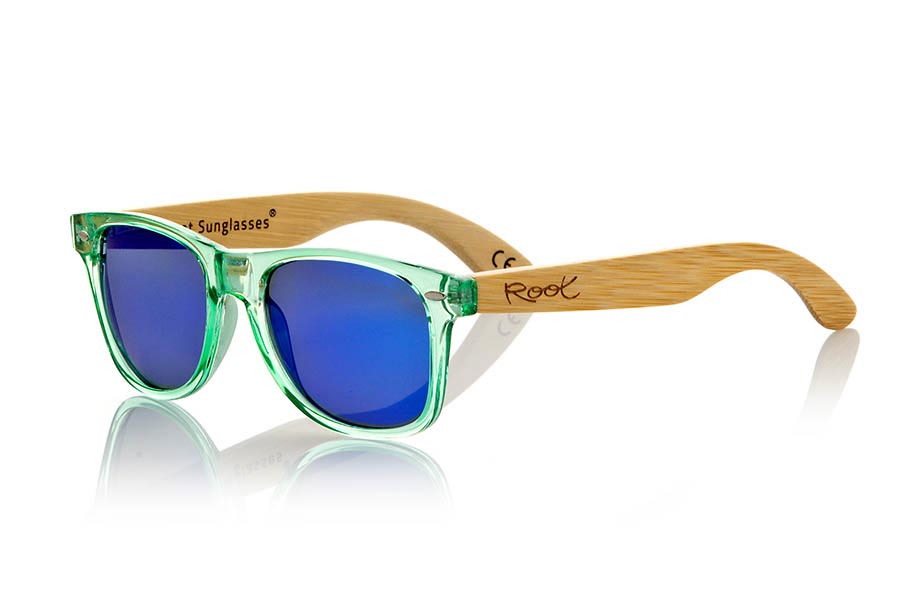 Wood eyewear of Bamboo CANDY GREEN. Candy Green sunglasses are made with green synthetic transparent front and sideburns in natural bamboo combined with four lens colors that will adapt perfectly to your taste and your modern style. Front Measure: 148x50mm for Wholesale & Retail | Root Sunglasses® 