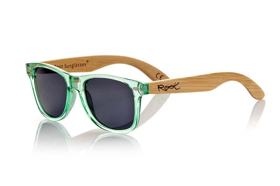 Wood eyewear of Bamboo CANDY GREEN. Candy Green sunglasses are made with green synthetic transparent front and sideburns in natural bamboo combined with four lens colors that will adapt perfectly to your taste and your modern style. Front Measure: 148x50mm for Wholesale & Retail | Root Sunglasses® 