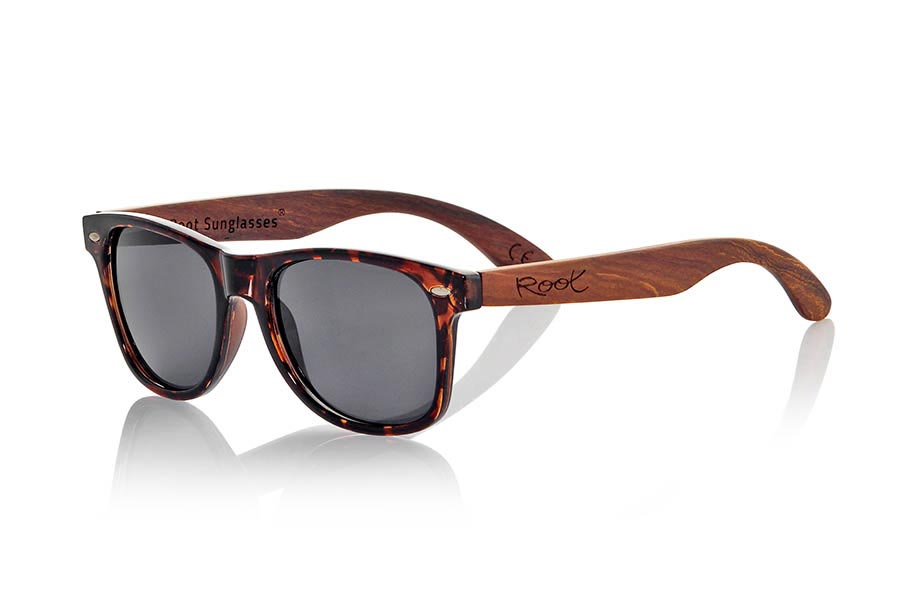 Wood eyewear of Rosewood CANDY TIGER. Candy Tiger sunglasses are made with Carey style synthetic transparent front and sideburns in natural rosewood combined with four lens colors that will adapt perfectly to your taste and your modern style. Front Measure: 148x50mm for Wholesale & Retail | Root Sunglasses® 