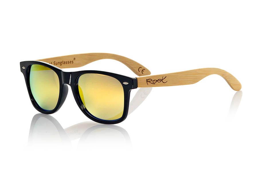 Wood eyewear of Bamboo CANDY BLACK. The Candy Black sunglasses are made with transparent sinthetic front in black gloss color and sideburns in natural bamboo combined with four lens colors that will adapt perfectly to your taste and your modern style. Front Measure: 148x50mm for Wholesale & Retail | Root Sunglasses® 