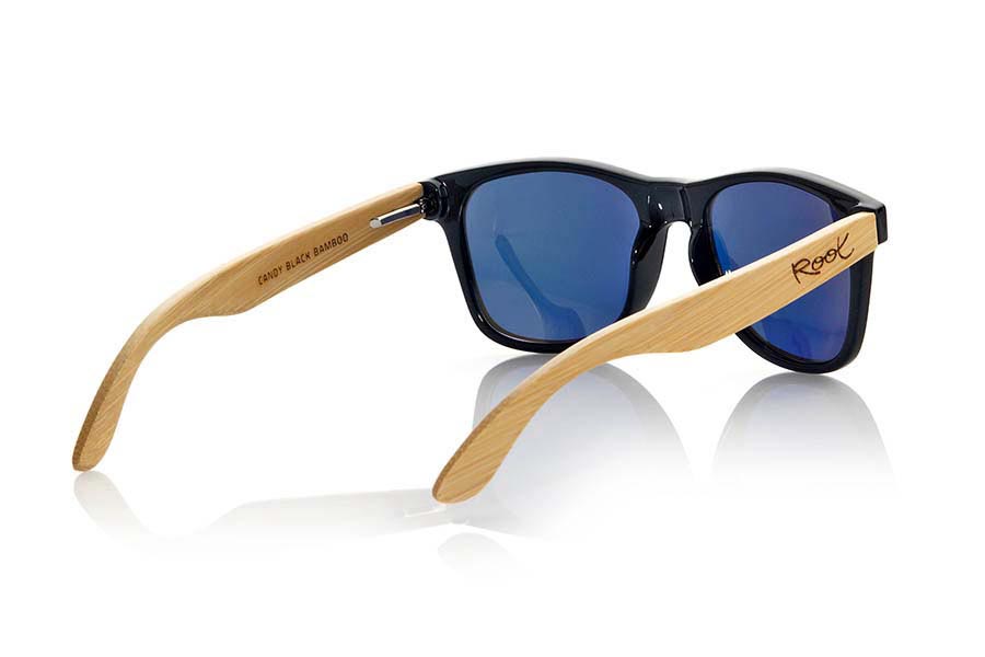 Wood eyewear of Bamboo CANDY BLACK. The Candy Black sunglasses are made with transparent sinthetic front in black gloss color and sideburns in natural bamboo combined with four lens colors that will adapt perfectly to your taste and your modern style. Front Measure: 148x50mm for Wholesale & Retail | Root Sunglasses® 