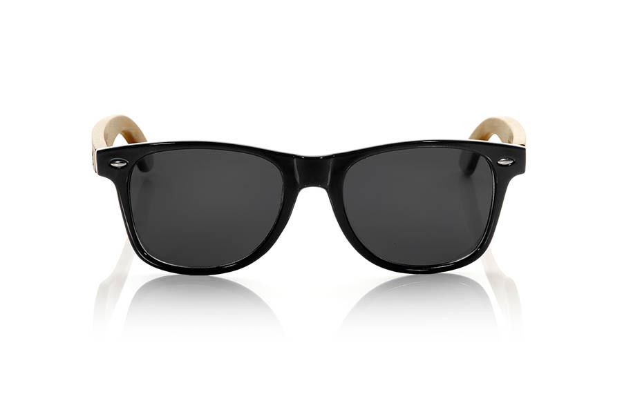 Wood eyewear of Bamboo CANDY BLACK. The Candy Black sunglasses are made with transparent sinthetic front in black gloss color and sideburns in natural bamboo combined with four lens colors that will adapt perfectly to your taste and your modern style. Front Measure: 148x50mm for Wholesale & Retail | Root Sunglasses® 