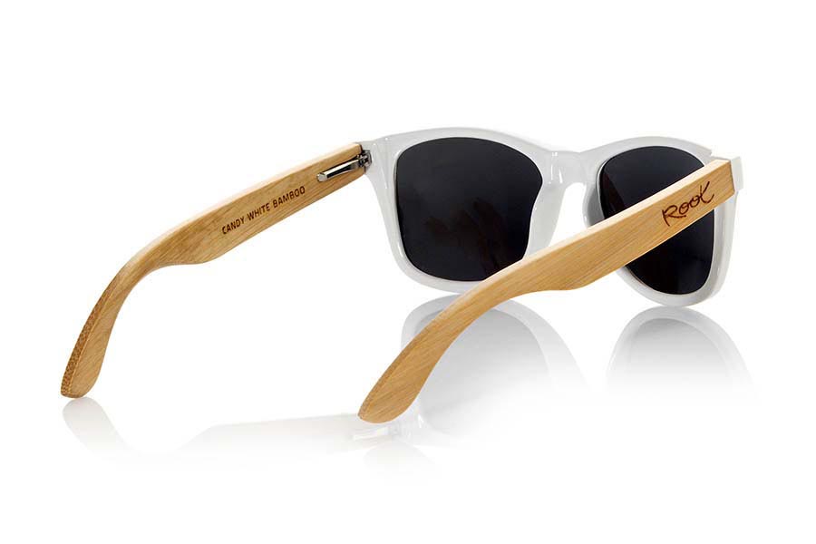 Wood eyewear of Bamboo CANDY WHITE. The Candy White sunglasses are made with transparent sinthetic front in white gloss color and sideburns in natural bamboo combined with four lens colors that will adapt perfectly to your taste and your modern style. Front Measure: 148x50mm for Wholesale & Retail | Root Sunglasses® 