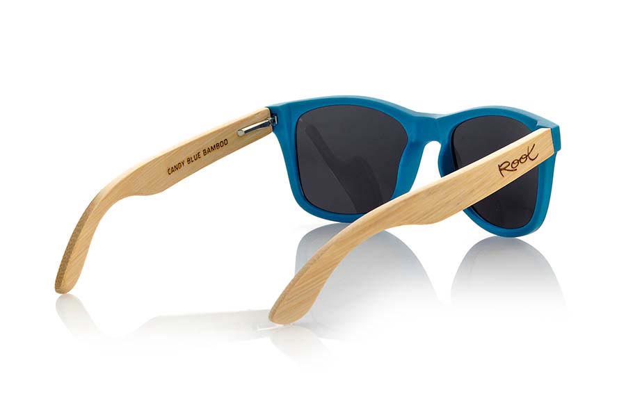 Wood eyewear of Bamboo MATT BLUE. The Matt Blue sunglasses are made with sinthetic front in blue matte color and sideburns in natural bamboo combined with four lens colors that will adapt perfectly to your taste and your modern style. Front Measure: 148x50mm for Wholesale & Retail | Root Sunglasses® 