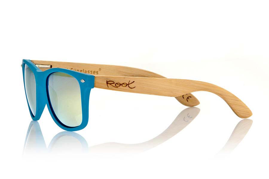 Wood eyewear of Bamboo MATT BLUE. The Matt Blue sunglasses are made with sinthetic front in blue matte color and sideburns in natural bamboo combined with four lens colors that will adapt perfectly to your taste and your modern style. Front Measure: 148x50mm for Wholesale & Retail | Root Sunglasses® 