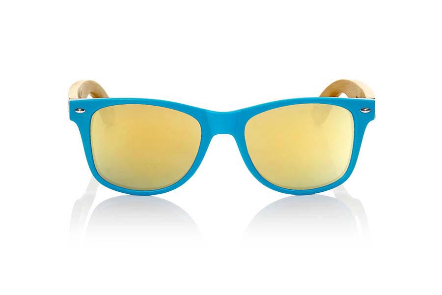 Wood eyewear of Bamboo MATT BLUE. The Matt Blue sunglasses are made with sinthetic front in blue matte color and sideburns in natural bamboo combined with four lens colors that will adapt perfectly to your taste and your modern style. Front Measure: 148x50mm for Wholesale & Retail | Root Sunglasses® 