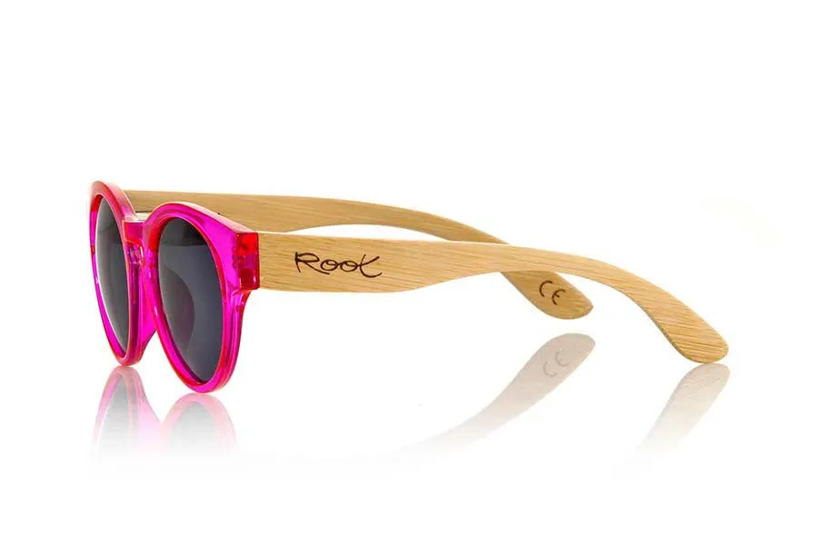 Wood eyewear of Bamboo GUM PINK. Gum Pink sunglasses are made with transparent sinthetic pink color front and sideburns in natural bamboo combined with four lens colors that will adapt perfectly to your taste and your modern style. It is a rounded frame unisex standard size easy to carry. Front Measure: 148x50mm for Wholesale & Retail | Root Sunglasses® 