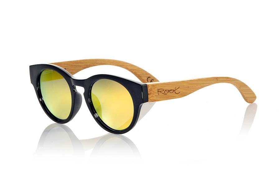 Wood eyewear of Bamboo GUM BLACK. Gum TR sunglasses are made with sinthetic shine black color front and sideburns in natural bamboo combined with four lens colors that will adapt perfectly to your taste and your modern style. It is a rounded frame unisex standard size easy to carry. Front Measure: 148x50mm for Wholesale & Retail | Root Sunglasses® 