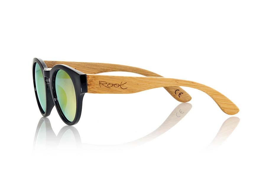 Wood eyewear of Bamboo GUM BLACK. Gum TR sunglasses are made with sinthetic shine black color front and sideburns in natural bamboo combined with four lens colors that will adapt perfectly to your taste and your modern style. It is a rounded frame unisex standard size easy to carry. Front Measure: 148x50mm for Wholesale & Retail | Root Sunglasses® 