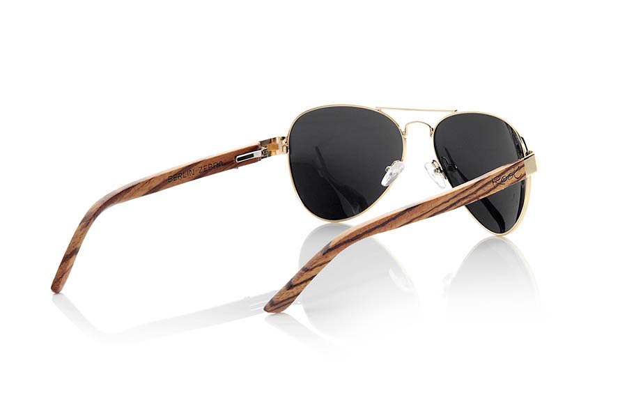 Wood eyewear of Zebra BERLIN. BERLIN sunglasses are made from the metal frame and sideburns natural Zebrano wood. A classic Aviator style model series combined with yellow lenses REVO, REVO Blue or Gray REVO. You'll love the combination of zebra wood. Front Measure: 150x50mm for Wholesale & Retail | Root Sunglasses® 
