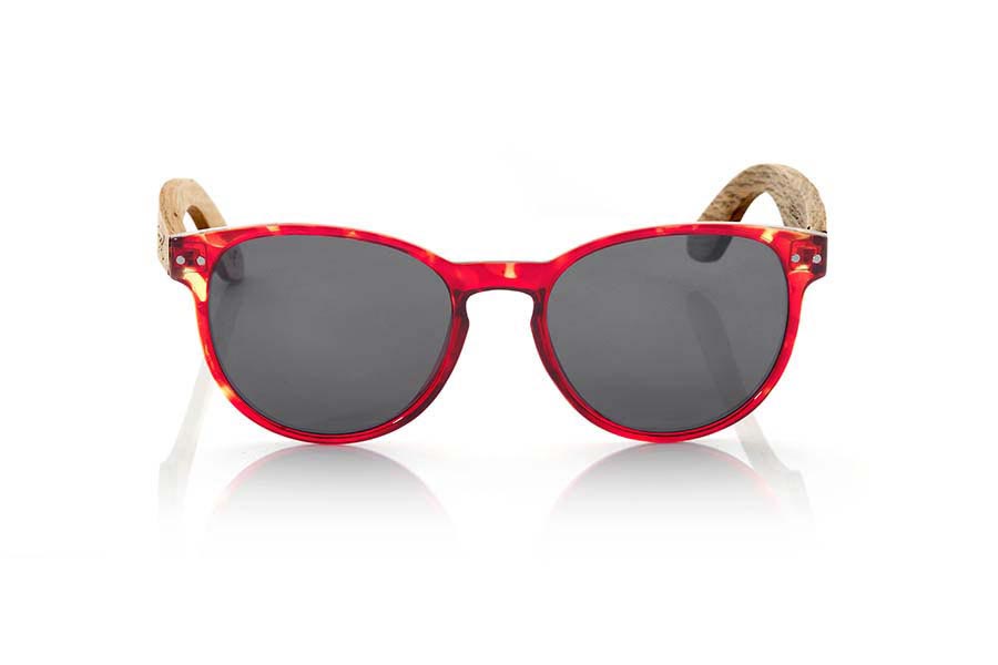 Wood eyewear of Duwood VIENNA. VIENNA sunglasses are made of synthetic material front carey red color and wooden pins Natural Duwood. It is a model of fine rounded shapes and mount that feel good to all kinds of people, VIENNA glasses have been combined as standard with Grey and Purple REVO lenses. Front Measure: 143x47mm for Wholesale & Retail | Root Sunglasses® 