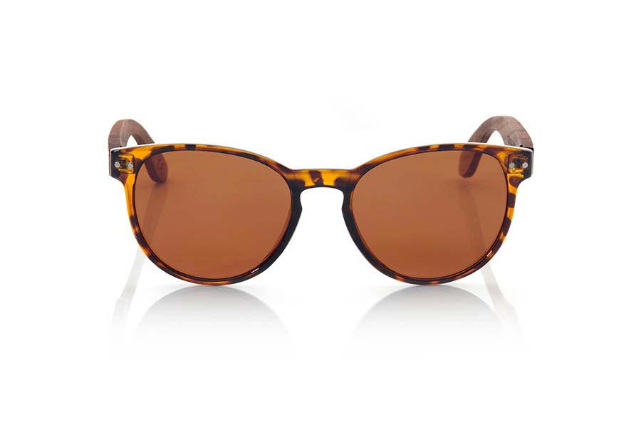 Wood eyewear of Rosewood GENOA. GENOA sunglasses are made from the front in plastic tortoiseshell colored and sideburns PALISANDRO Natural wood. This is a very fine pattern rounded shapes and mount that feel good to all kinds of people, GENOA glasses have been combined as standard with lenses Grey, Brown and Yellow REVO. Front Measure: 143x47mm for Wholesale & Retail | Root Sunglasses® 