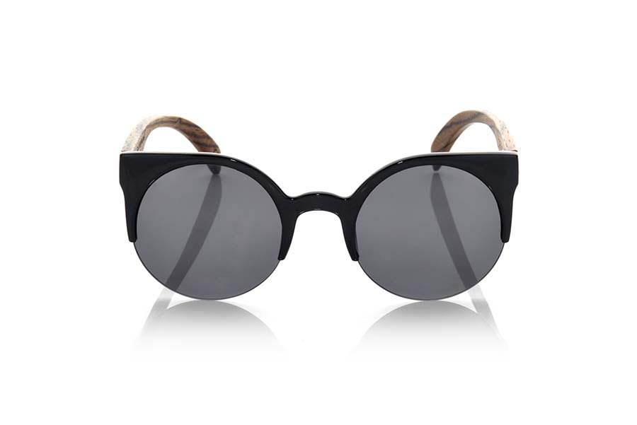 Wood eyewear of Zebrano CAT BLACK. CAT BLACK sunglasses are made of black synthetic material front and sideburns in natural zebrano wood, it's an open round model with straight eyebrow more aimed at a female audience combined with four colors of lenses. Front size: 135X53mm for Wholesale & Retail | Root Sunglasses® 