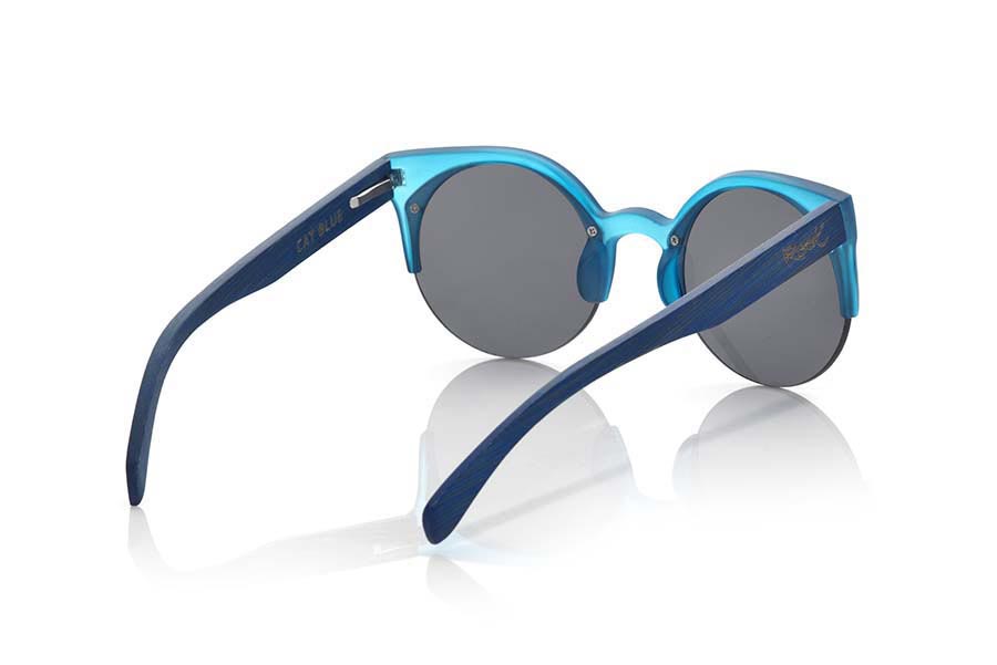 Wood eyewear of Bamboo CAT BLUE. CAT BLUE sunglasses are made of synthetic material blue transparent Matt front and sideburns in tinted bamboo wood, it's an open round model with straight eyebrow more aimed at a female audience combined with four colors of lenses. Front size: 135X53mm for Wholesale & Retail | Root Sunglasses® 