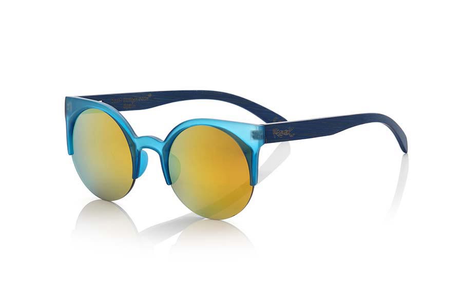 Wood eyewear of Bamboo CAT BLUE. CAT BLUE sunglasses are made of synthetic material blue transparent Matt front and sideburns in tinted bamboo wood, it's an open round model with straight eyebrow more aimed at a female audience combined with four colors of lenses. Front size: 135X53mm for Wholesale & Retail | Root Sunglasses® 