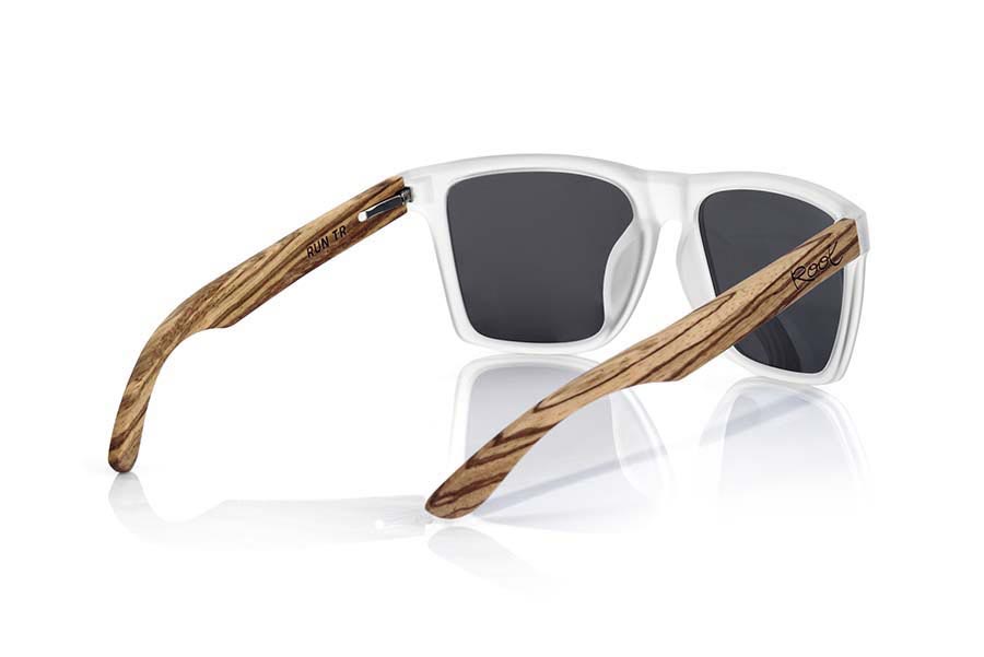 Wood eyewear of Zebrano RUN TR. RUN TR sunglasses are made of transparent matte plastic front and ZEBRA wood pins, it's a very male angled square model with a look at the famous okley combined with four colors of lenses that will adapt perfectly to your taste and to your modern style. Front size: 144X51mm for Wholesale & Retail | Root Sunglasses® 