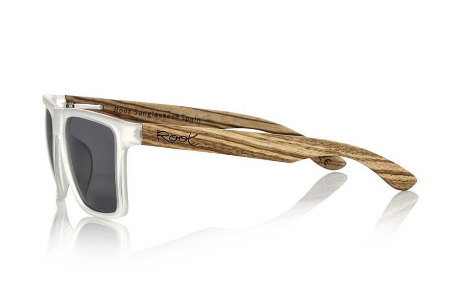 Wood eyewear of Zebrano RUN TR. RUN TR sunglasses are made of transparent matte plastic front and ZEBRA wood pins, it's a very male angled square model with a look at the famous okley combined with four colors of lenses that will adapt perfectly to your taste and to your modern style. Front size: 144X51mm for Wholesale & Retail | Root Sunglasses® 