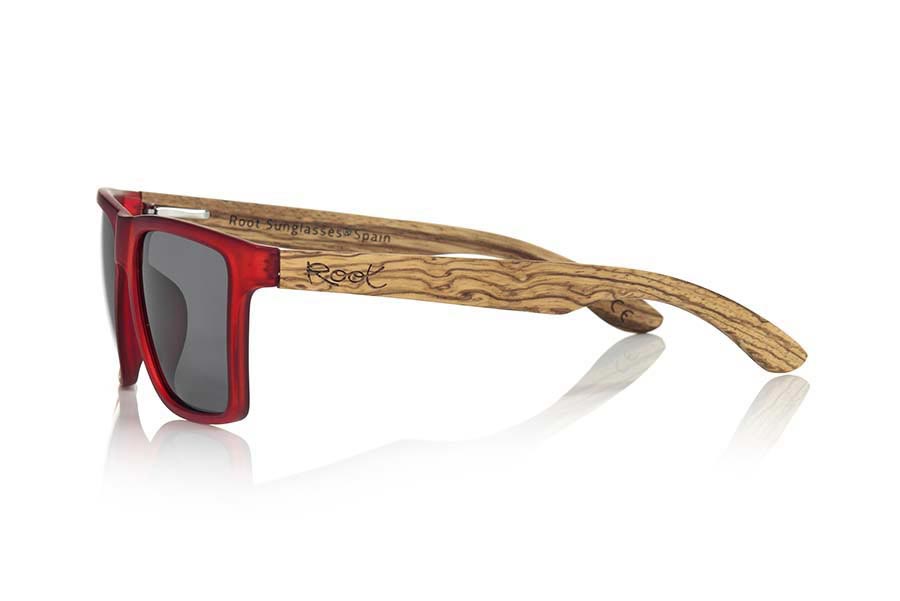 Wood eyewear of Zebrano RUN RED. RUN RED sunglasses are made of transparent matte red synthetic material front and ZEBRA wood pins, it's a very male angled square model with a look at the famous okley combined with four colors of lenses that will adapt perfectly to your taste and to your modern style. Front size: 144X51mm for Wholesale & Retail | Root Sunglasses® 