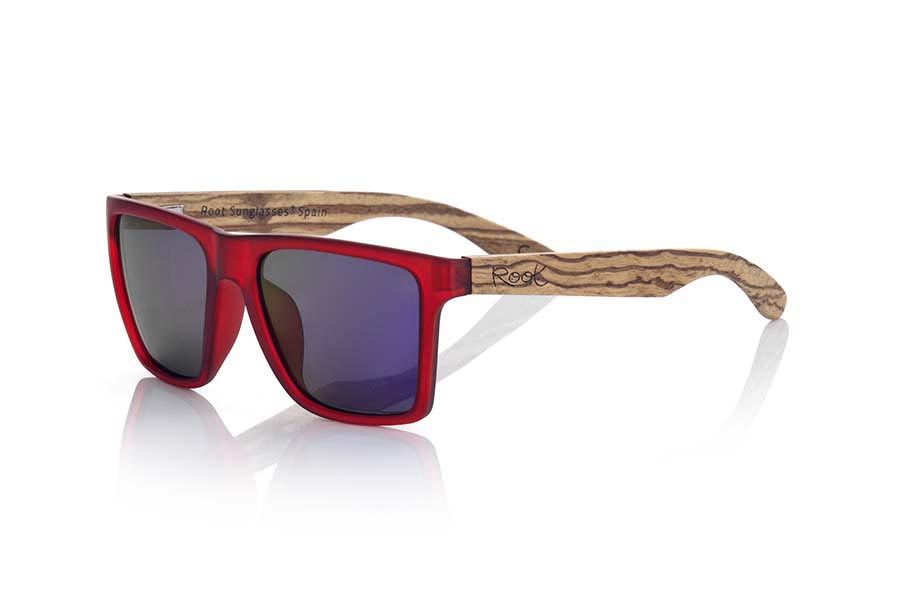 Wood eyewear of Zebrano RUN RED. RUN RED sunglasses are made of transparent matte red synthetic material front and ZEBRA wood pins, it's a very male angled square model with a look at the famous okley combined with four colors of lenses that will adapt perfectly to your taste and to your modern style. Front size: 144X51mm for Wholesale & Retail | Root Sunglasses® 