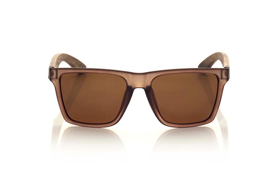 Wood eyewear of Rosewood RUN BROWN. RUN BRIOWN sunglasses are made with the front of transparent matte Brown synthetic material and sideburns in ROSEWOOD, it is a very male angled square model with a look at the famous okley combined with four colors of lenses that will adapt perfectly to your taste and to your modern style. Front size: 144X51mm for Wholesale & Retail | Root Sunglasses® 