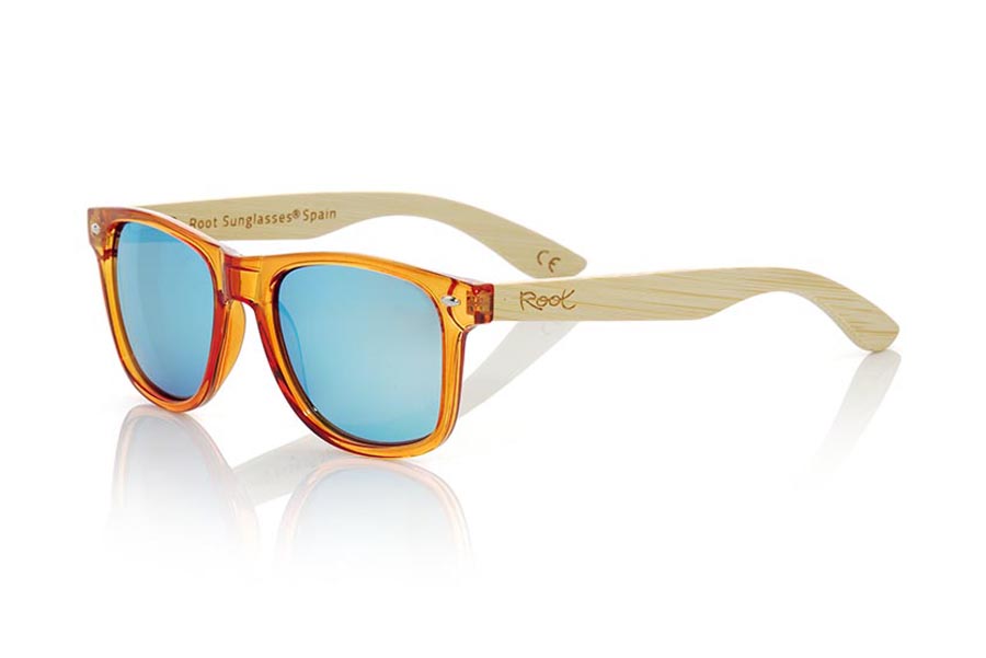 Wood eyewear of Bamboo CANDY ORANGE. Candy Orange sunglasses are made with synthetic dark Orange transparent front and sideburns in natural bamboo combined with four lens colors that will adapt perfectly to your taste and your modern style. Front Measure: 148x50mm for Wholesale & Retail | Root Sunglasses® 