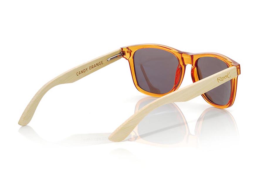 Wood eyewear of Bamboo CANDY ORANGE. Candy Orange sunglasses are made with synthetic dark Orange transparent front and sideburns in natural bamboo combined with four lens colors that will adapt perfectly to your taste and your modern style. Front Measure: 148x50mm for Wholesale & Retail | Root Sunglasses® 