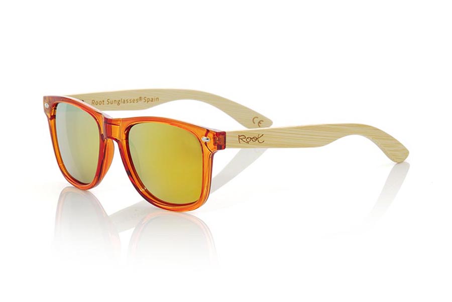 Wood eyewear of Bamboo CANDY ORANGE. Candy Orange sunglasses are made with synthetic dark Orange transparent front and sideburns in natural bamboo combined with four lens colors that will adapt perfectly to your taste and your modern style. Front Measure: 148x50mm for Wholesale & Retail | Root Sunglasses® 