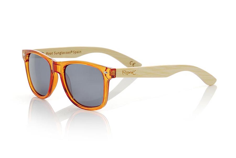 Wood eyewear of Bamboo CANDY ORANGE. Candy Orange sunglasses are made with synthetic dark Orange transparent front and sideburns in natural bamboo combined with four lens colors that will adapt perfectly to your taste and your modern style. Front Measure: 148x50mm for Wholesale & Retail | Root Sunglasses® 