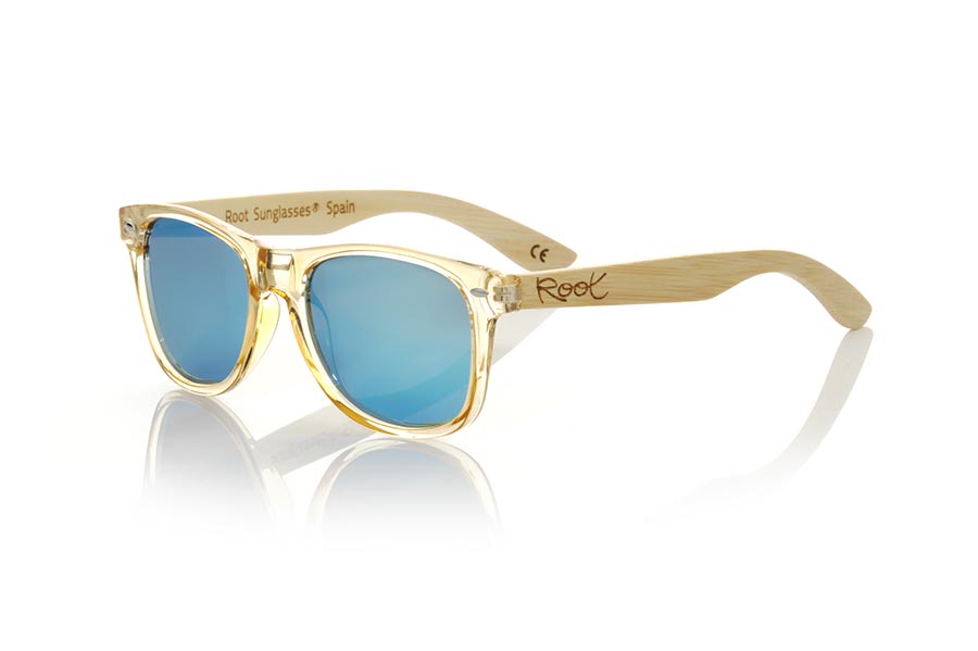Gafas de Madera Natural de Bambú CANDY YELLOW. Las gafas de sol Candy Yellow están fabricadas con el frontal en material sintético Amarillo oscuro transparente y las patillas de madera de bambú natural combinadas con cuatro colores de lentes que te permitirán adaptarlas a tu estilo. Medida frontal: 148x50mm Venta al Por Mayor y Detalle | Root Sunglasses® 