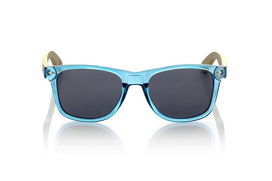 Wood eyewear of Bamboo CANDY BLUE. The Candy Blue sunglasses are made with sinthetic front in blue transparent and sideburns in natural bamboo combined with four lens colors that will adapt perfectly to your taste and your modern style. Front Measure: 148x50mm for Wholesale & Retail | Root Sunglasses® 