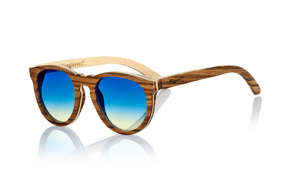 Wood eyewear of Zebrano MOJAVE. Mojave sunglasses are manufactured in Zebrano wood and maple. Zebrano wood is interspersed with a thin sheet of maple that gives this frame a very unique touch hardwood. CR39 lenses are combined with degraded blue or brown, rounded mount feel good to people whose tastes match such forms. The Sirius will surprise you with its combination of woods. Dimensions: 144x54mm for Wholesale & Retail | Root Sunglasses® 