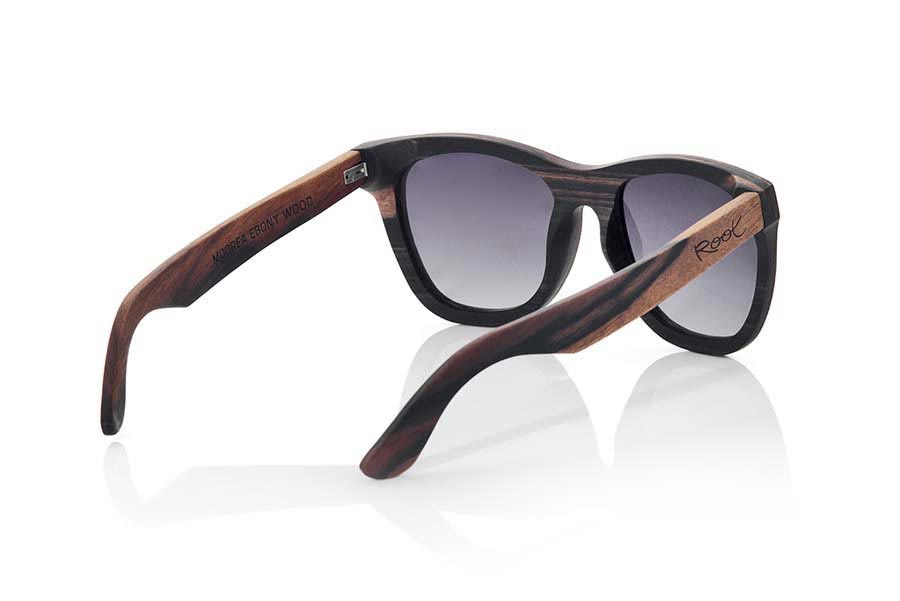 Wood eyewear of Ebony MOOREA. MOOREA sunglasses are manufactured with a combination of 2 Woods, wood of ebony and DuWood. The front of this classical forms a little rounded glass suitable for all kinds of people of both sexes has a combination of these two Woods in a vertical design showing the most dark wood such as ebony wood on the top and wood Du, a similar to Oak wood clear wood shown in the lower part of the front. The pins are manufactured entirely in ebony wood. You will be surprised the elegance of this model back design. Front size: 145x54mm for Wholesale & Retail | Root Sunglasses® 