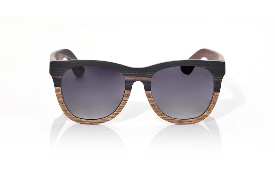 Wood eyewear of Ebony MOOREA. MOOREA sunglasses are manufactured with a combination of 2 Woods, wood of ebony and DuWood. The front of this classical forms a little rounded glass suitable for all kinds of people of both sexes has a combination of these two Woods in a vertical design showing the most dark wood such as ebony wood on the top and wood Du, a similar to Oak wood clear wood shown in the lower part of the front. The pins are manufactured entirely in ebony wood. You will be surprised the elegance of this model back design. Front size: 145x54mm for Wholesale & Retail | Root Sunglasses® 