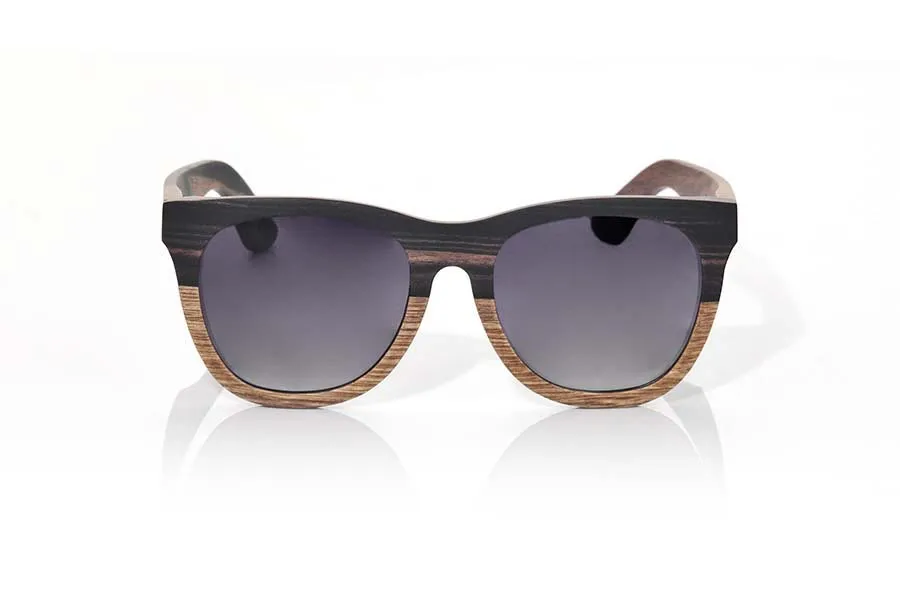 Wood eyewear of Ebony MOOREA. MOOREA sunglasses are manufactured with a combination of 2 Woods, wood of ebony and DuWood. The front of this classical forms a little rounded glass suitable for all kinds of people of both sexes has a combination of these two Woods in a vertical design showing the most dark wood such as ebony wood on the top and wood Du, a similar to Oak wood clear wood shown in the lower part of the front. The pins are manufactured entirely in ebony wood. You will be surprised the elegance of this model back design. Front size: 145x54mm for Wholesale & Retail | Root Sunglasses® 