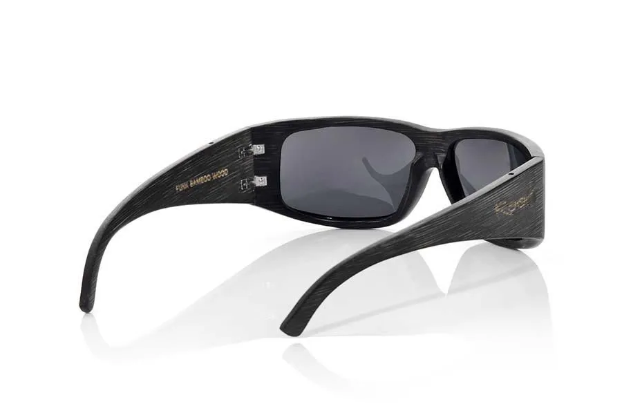 Wood eyewear of Bamboo FUNK. FUNK sunglasses are made of bamboo wood stained in dark brown tones. The front of this glass is curved in such a way that it covers the entire face is defortivo design and is suitable for all kinds of people of both sexes.  The pins are very wide so that they cover most of the face are made of solid bmbu dyed in shades of dark brown wood. The lightness of this glass, their resistance and the combination of lenses will surprise you. Front size: 150x47mm for Wholesale & Retail | Root Sunglasses® 
