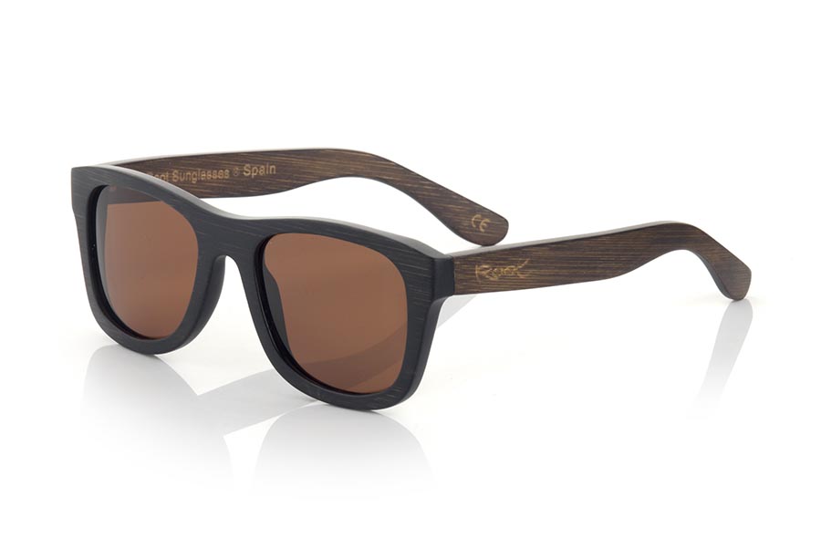 Wood eyewear of  GENESIS. Genesis Wood Sunglasses are made in two-tone tinted bamboo with black front and dark brown sideburns. In classical forms, the Genesis is a unisex model, elegant and discreet, however they will not be able to stop looking at you. frontal measurement:  146x50mm for Wholesale & Retail | Root Sunglasses® 