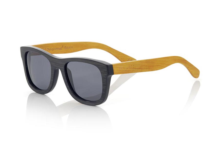 Wood eyewear of Bamboo ONEGA. ONEGA sunglasses are made of bamboo wood combining the frontal in natural bamboo with a black tinted with natural bamboo sideburns with a YELLOW tint, is a classic mount of a size that adapts well to all types of faces of both men and women . The ONEGA is a bet in blue that keeps your eyes clean.  Frontal measurement: 146x50 for Wholesale & Retail | Root Sunglasses® 