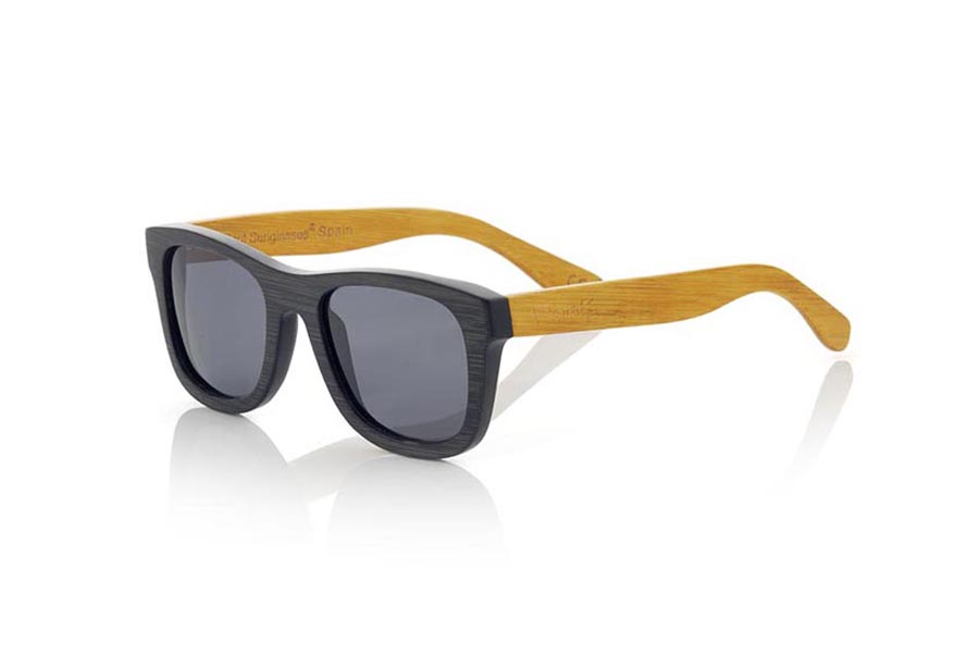 Wood eyewear of Bamboo ONEGA S. ONEGA S sunglasses are made of bamboo wood combining the front in natural bamboo with a black tinted with natural bamboo sideburns with a YELLOW tint, is a classic mount with a small size for people who feel better glasses  Small. The ONEGA S are a bet in YELLOW that keeps your eyes clean.  Frontal measurement: 136x44 for Wholesale & Retail | Root Sunglasses® 