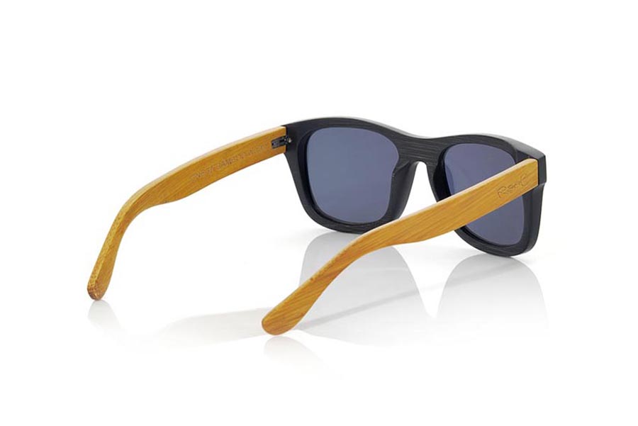 Wood eyewear of Bamboo ONEGA S. ONEGA S sunglasses are made of bamboo wood combining the front in natural bamboo with a black tinted with natural bamboo sideburns with a YELLOW tint, is a classic mount with a small size for people who feel better glasses  Small. The ONEGA S are a bet in YELLOW that keeps your eyes clean.  Frontal measurement: 136x44 for Wholesale & Retail | Root Sunglasses® 