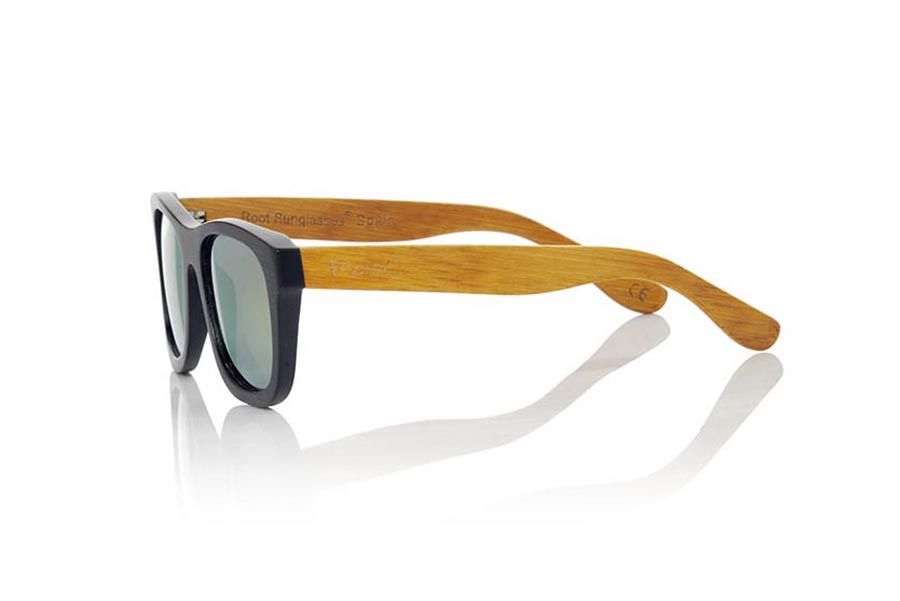 Wood eyewear of Bamboo ONEGA S. ONEGA S sunglasses are made of bamboo wood combining the front in natural bamboo with a black tinted with natural bamboo sideburns with a YELLOW tint, is a classic mount with a small size for people who feel better glasses  Small. The ONEGA S are a bet in YELLOW that keeps your eyes clean.  Frontal measurement: 136x44 for Wholesale & Retail | Root Sunglasses® 