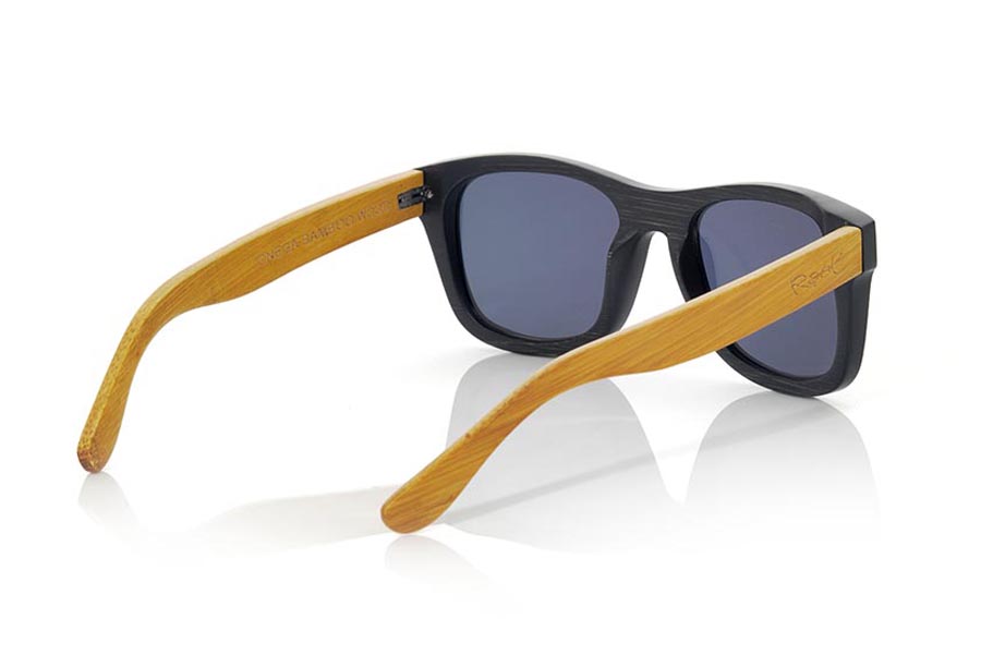 Wood eyewear of Bamboo ONEGA. ONEGA sunglasses are made of bamboo wood combining the frontal in natural bamboo with a black tinted with natural bamboo sideburns with a YELLOW tint, is a classic mount of a size that adapts well to all types of faces of both men and women . The ONEGA is a bet in blue that keeps your eyes clean.  Frontal measurement: 146x50 for Wholesale & Retail | Root Sunglasses® 