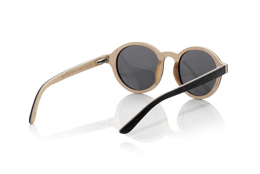 Wood eyewear of mpingo MISTRAL. The MISTRAL sunglasses are made from a combination of MPINGO and sandalwood. The front of this soft-line glass is made by combining Mpingo laminated wood in the upper part and white sandalwood in the lower area.  The sideburns are fine made with the exterior in Mpingo and maple wood inside. You will be surprised by the design and the beauty of the woods. Frontal measurement: 145x50mm for Wholesale & Retail | Root Sunglasses® 