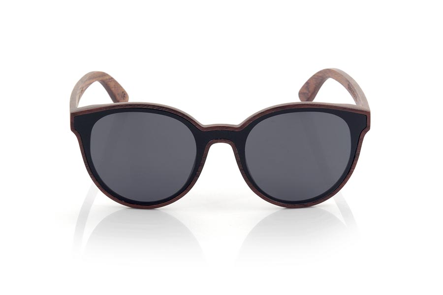 Wood eyewear of rosewood SENA. SENA sunglasses are made of natural rosewood. It is a rounded model with total lens and a very subtle wooden frame. SENA surprises with the beauty of wood in combination with the Total lens. Front measurement: 145x54mm for Wholesale & Retail | Root Sunglasses® 