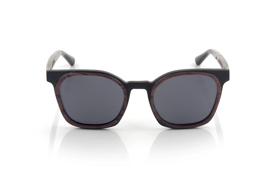 Wood eyewear of ebony GUSTAV. GUSTAV sunglasses are manufactured in a combination of two woods, ebony in the frame and inside of the temples and Rosewood in the outer ring of the frame and the outside of the temples. The latter are finished in carey acetate with internal rod which allow to be adjusted if necessary. It is a model with its own personality and a very careful finish that will surprise you with its originality and the combination of woods. Front measurement: 141x48mm for Wholesale & Retail | Root Sunglasses® 