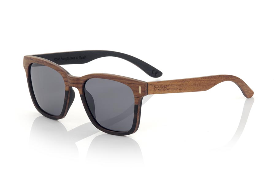 Wood eyewear of ebony URA. The URA sunglasses are manufactured in a combination of two woods, Ebony in the lower part of the frame and inside the temples and Rosewood in the upper part of the frame and outside the temples. It is a simple and elegant, easy to wear model with a very careful finishing that will surprise you with its originality and the combination of woods. Front measure: 145x50mm for Wholesale & Retail | Root Sunglasses® 