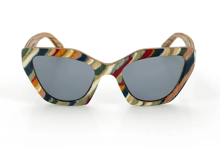 Wood eyewear of Zebrano PAI. PAI wooden sunglasses are made from laminated skateboard wood, with a multi-coloured finish that highlights their distinctive design. Their layered structure highlights natural textures, combining a striking front with a zebrawood interior that provides an elegant contrast.

The butterfly-shaped design offers a bold and original silhouette, balancing style and comfort. Thanks to their laminated wood construction, they are resistant and light, ideal for daily use.

The high-quality polarised lenses fully protect against UV rays and reduce glare, providing a clearer and more comfortable vision. A different proposal within the wooden glasses collection, connecting design and natural materials.

Dimensions 144x50 mm. Caliber 53 for Wholesale & Retail | Root Sunglasses® 