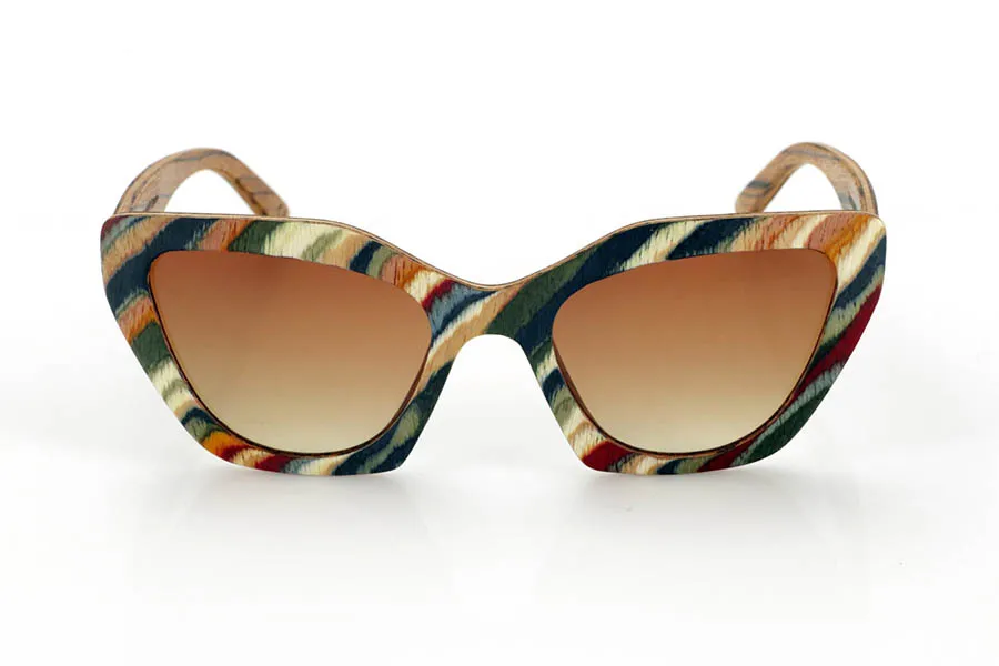 Wood eyewear of Zebrano PAI. PAI wooden sunglasses are made from laminated skateboard wood, with a multi-coloured finish that highlights their distinctive design. Their layered structure highlights natural textures, combining a striking front with a zebrawood interior that provides an elegant contrast.

The butterfly-shaped design offers a bold and original silhouette, balancing style and comfort. Thanks to their laminated wood construction, they are resistant and light, ideal for daily use.

The high-quality polarised lenses fully protect against UV rays and reduce glare, providing a clearer and more comfortable vision. A different proposal within the wooden glasses collection, connecting design and natural materials.

Dimensions 144x50 mm. Caliber 53 for Wholesale & Retail | Root Sunglasses® 